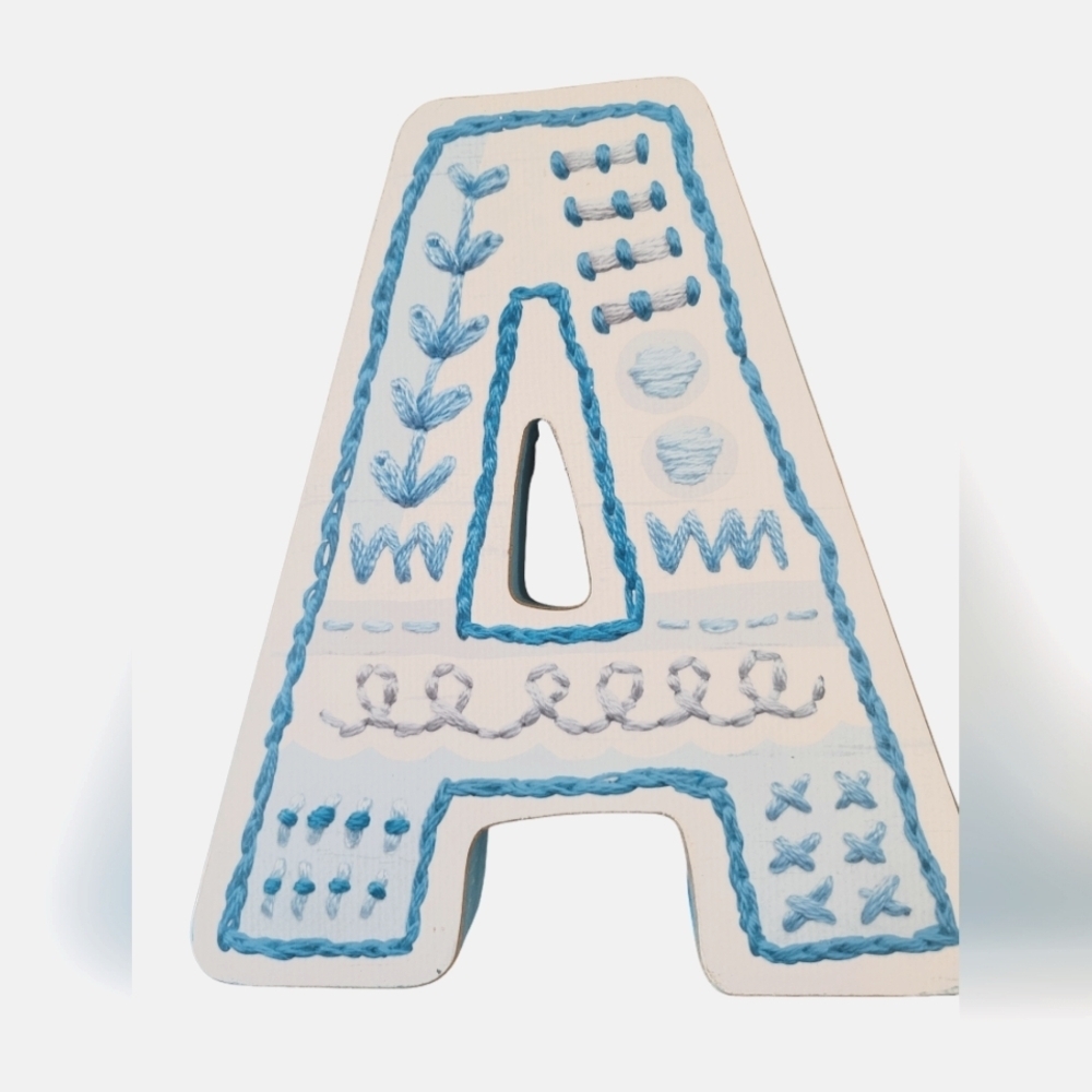 A Letter shelf sitter or wall hanger